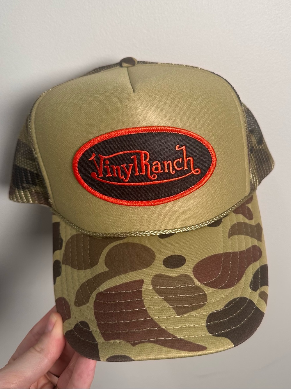 Camo Trucker Hat - Olive with Orange Logo